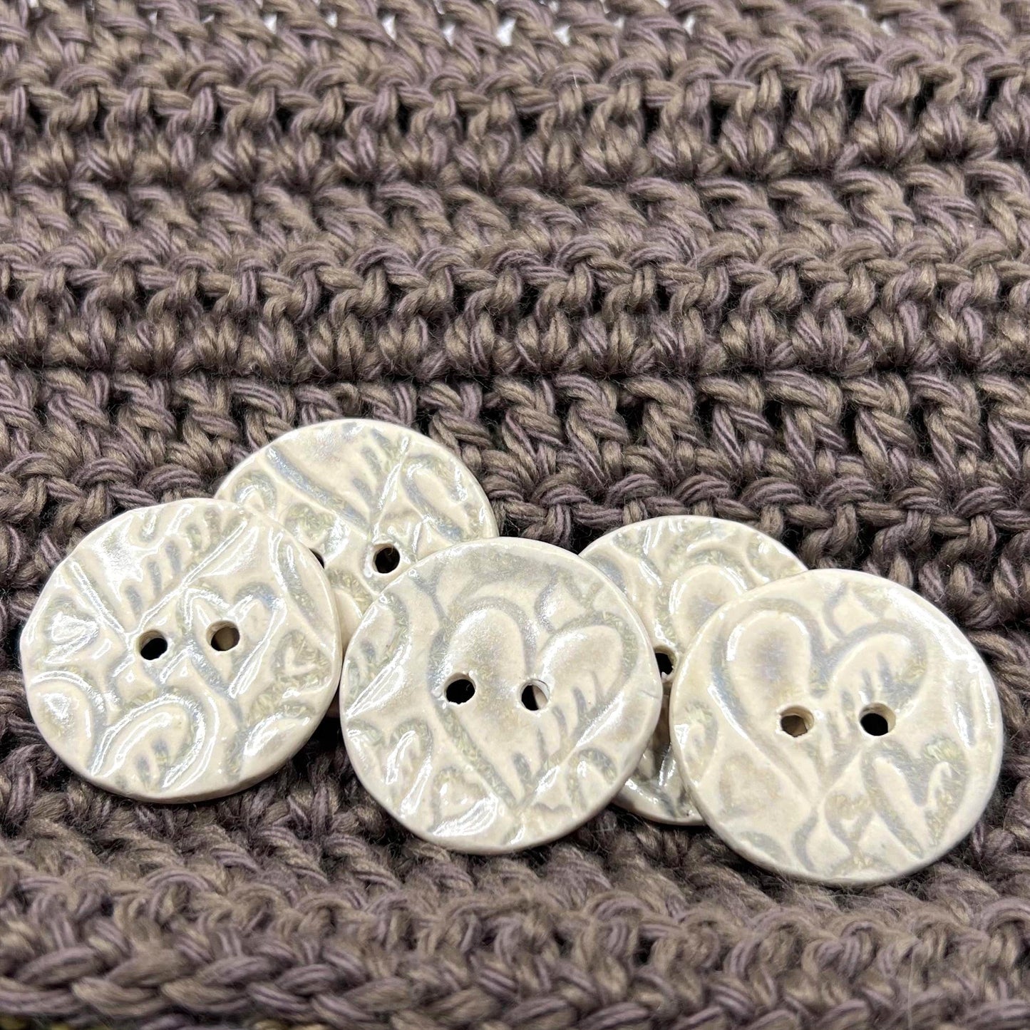 4 White Round Buttons with Light Gray Heart Pattern