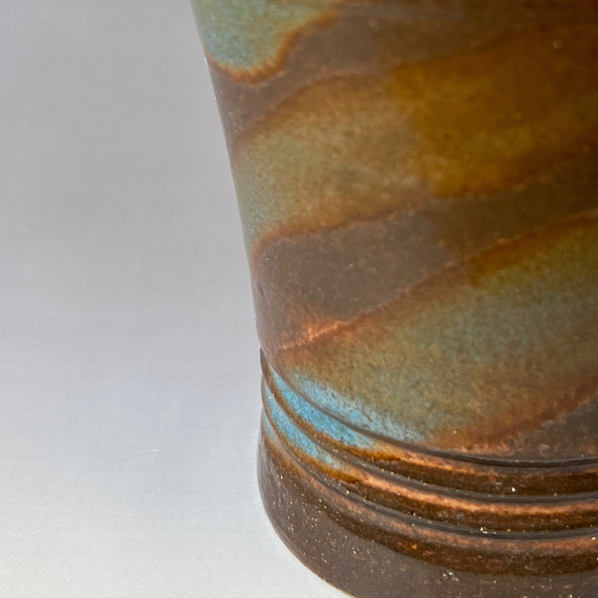 Green, Brown, and Blue Brown Stoneware Tumbler