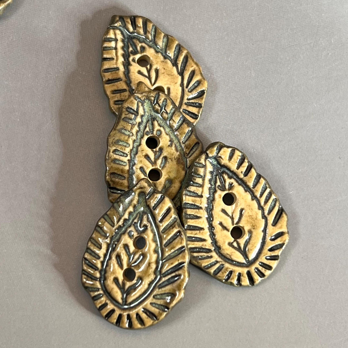 Natural Paisley with Dark Green Details Teardrop Shaped Ceramic Button