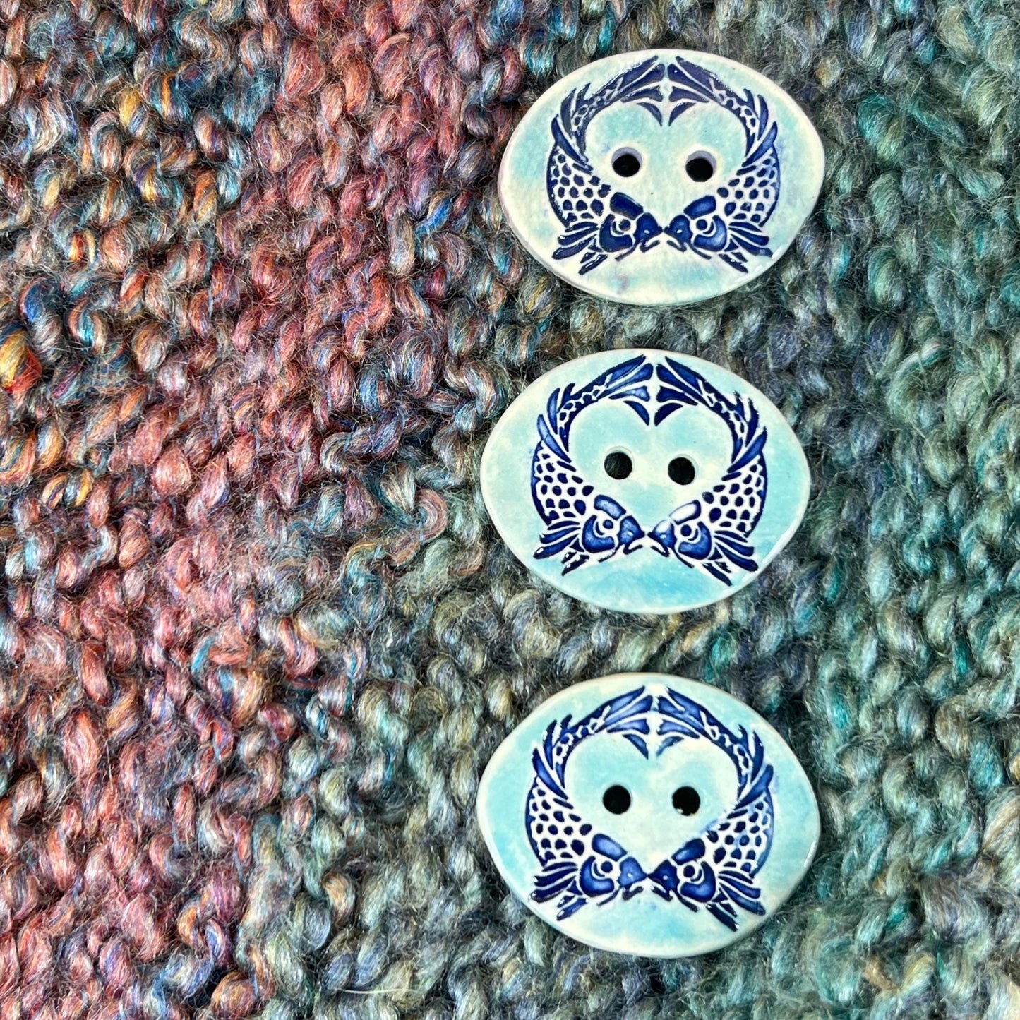 Two Koi Heart on Light Blue Oval Button