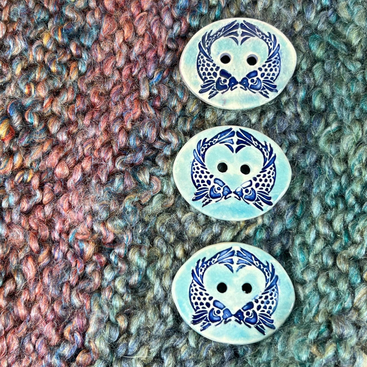 Two Koi Heart on Light Blue Oval Button