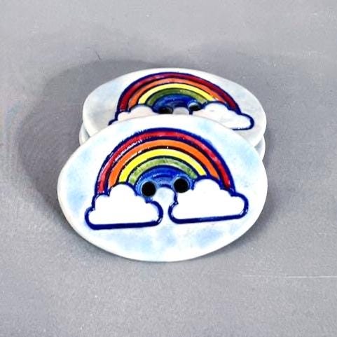 Large Rainbow on Light Blue Oval Button