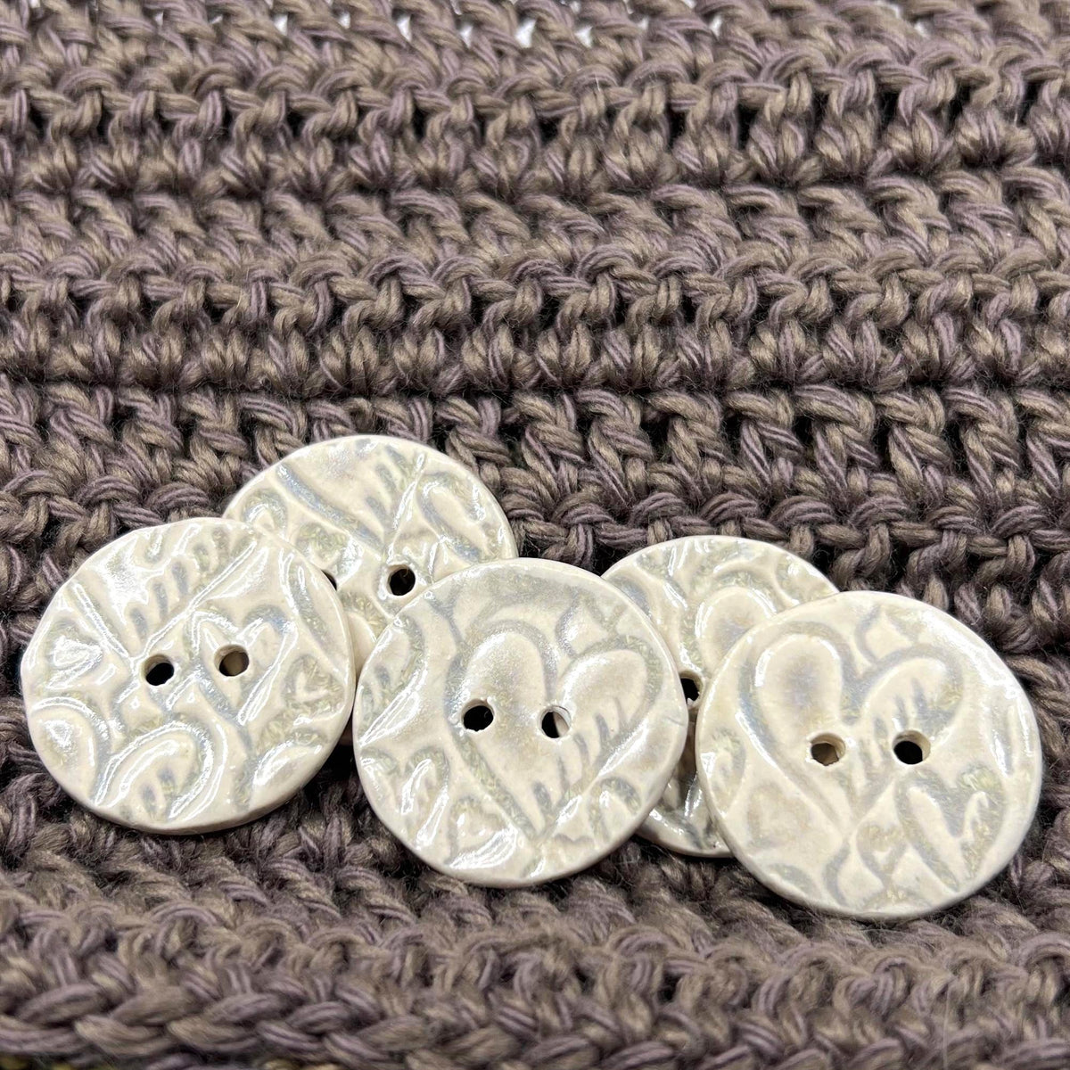 4 White Round Buttons with Light Gray Heart Pattern