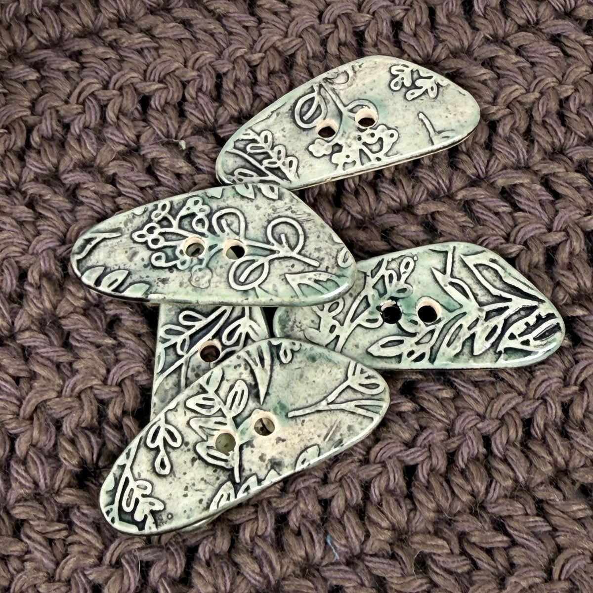 Green Washed Triangular Button with Flower and Plant Texture