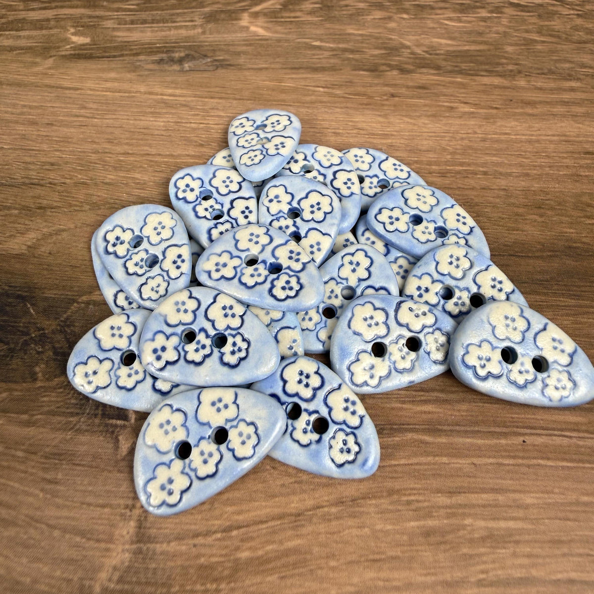 Set of 5 Small Blue Triangular Shaped Buttons with White Flowers