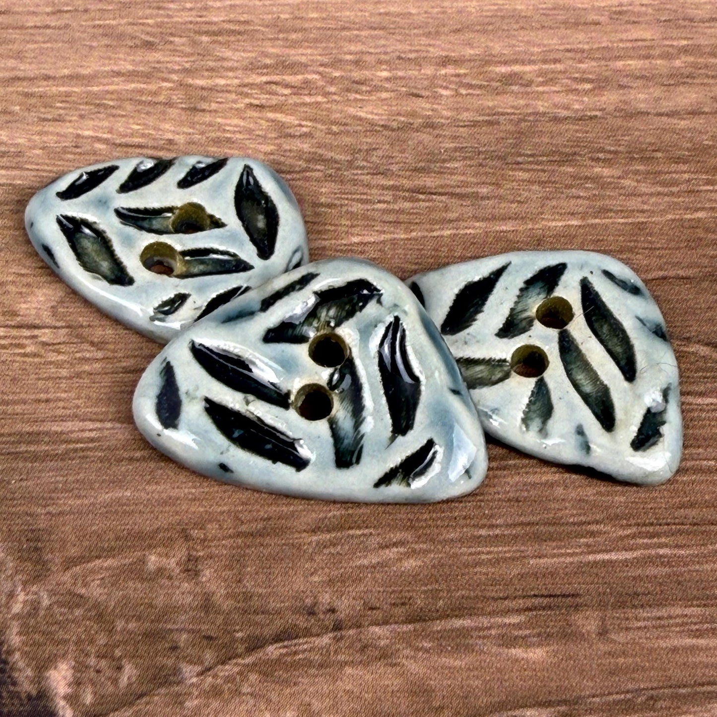 Small Triangular Shaped Buttons in Light Sage with Dark Sage Leaf Pattern