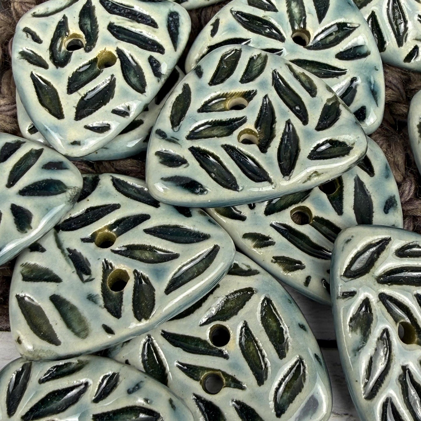 Triangular Shaped Buttons in Light Sage with Dark Sage Leaf Pattern