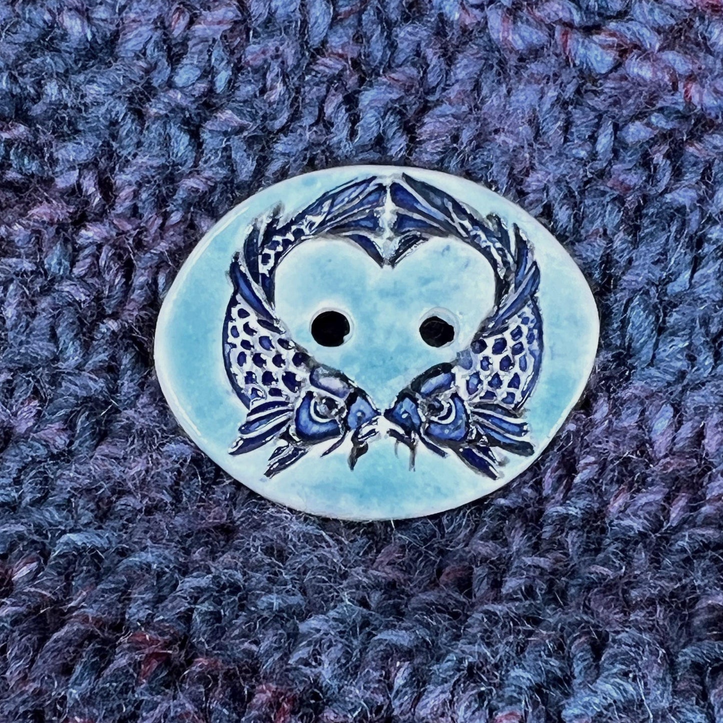 Two Koi Heart with Black Line Work on Light Blue Oval Button