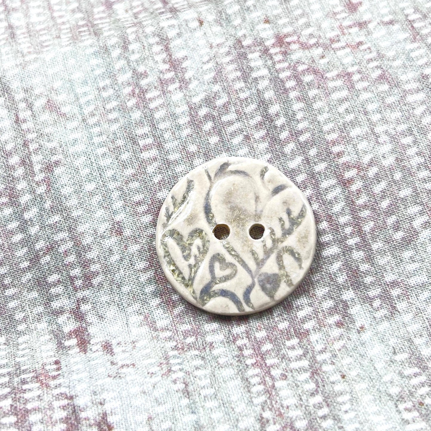 4 White Round Buttons with Light Gray Heart Pattern