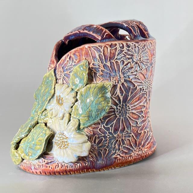 Pink and Purple Flower Brick/Vase with White  Flowers and Green Leaves