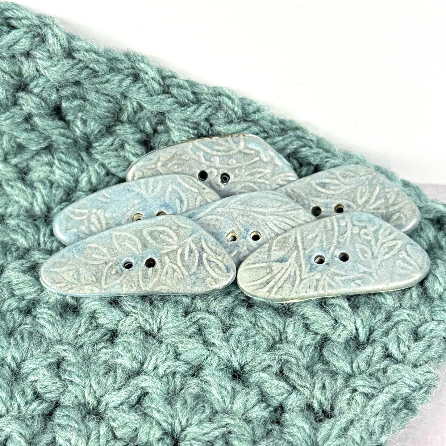 Blue Matte Triangular Button with Flower and Plant Texture