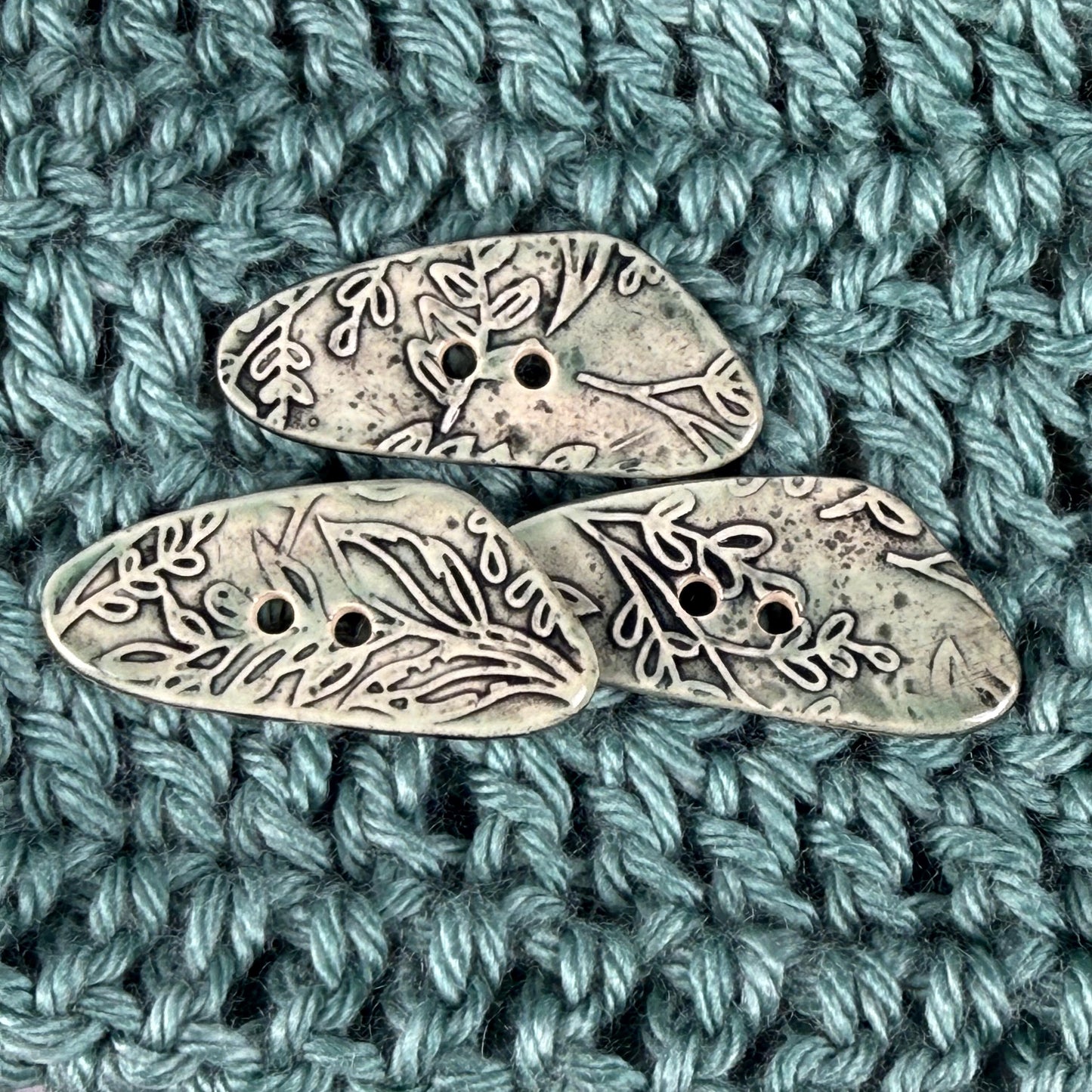 Green Washed Triangular Button with Flower and Plant Texture
