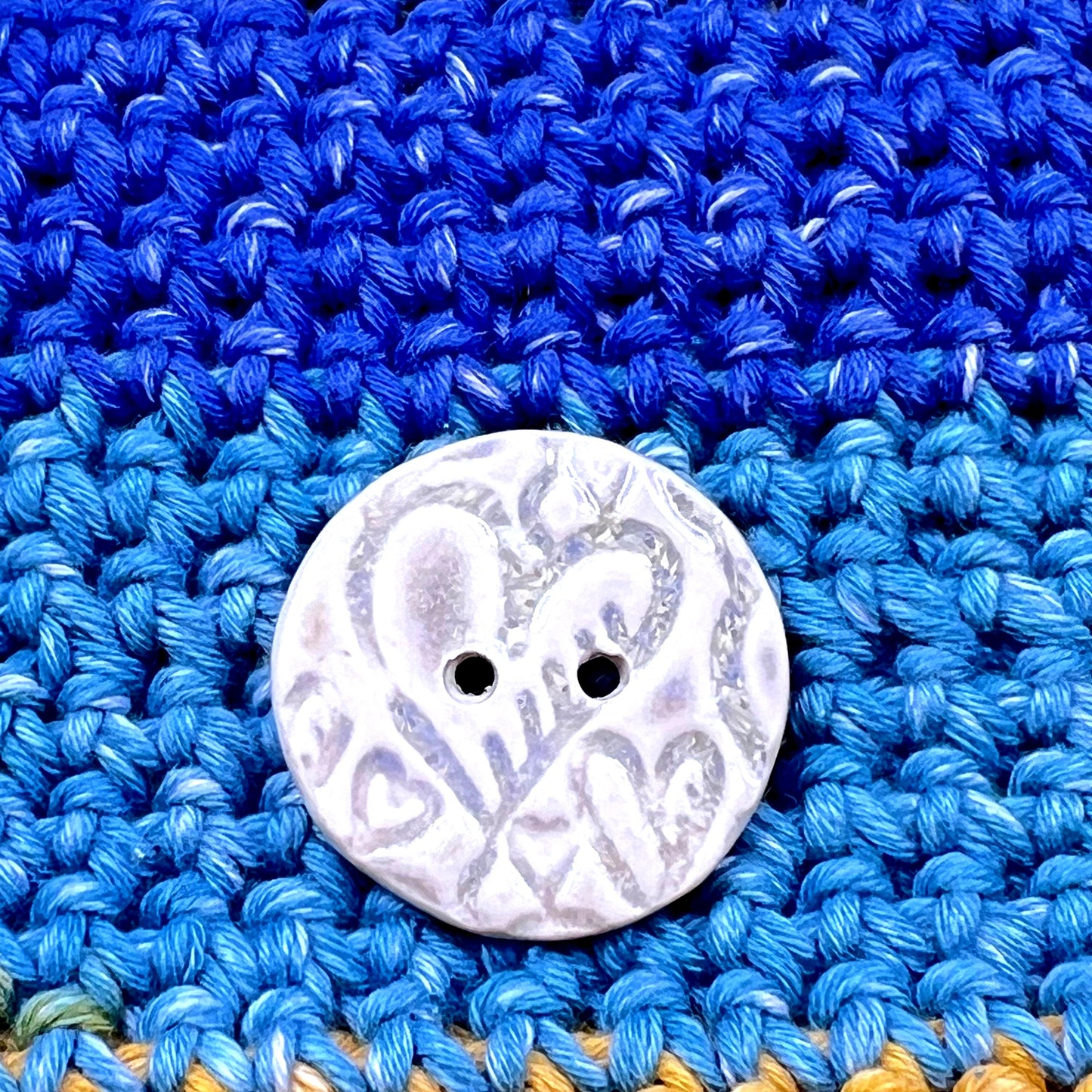 4 White Round Buttons with Light Gray Heart Pattern