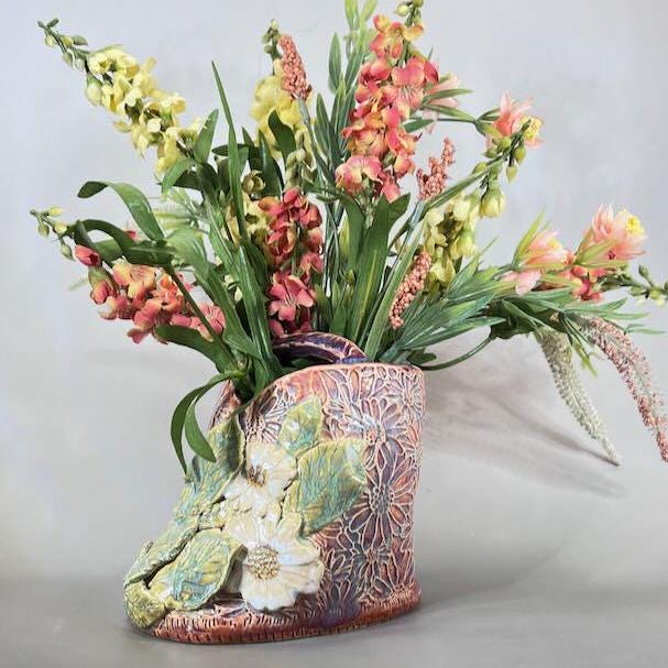 Pink and Purple Flower Brick/Vase with White  Flowers and Green Leaves
