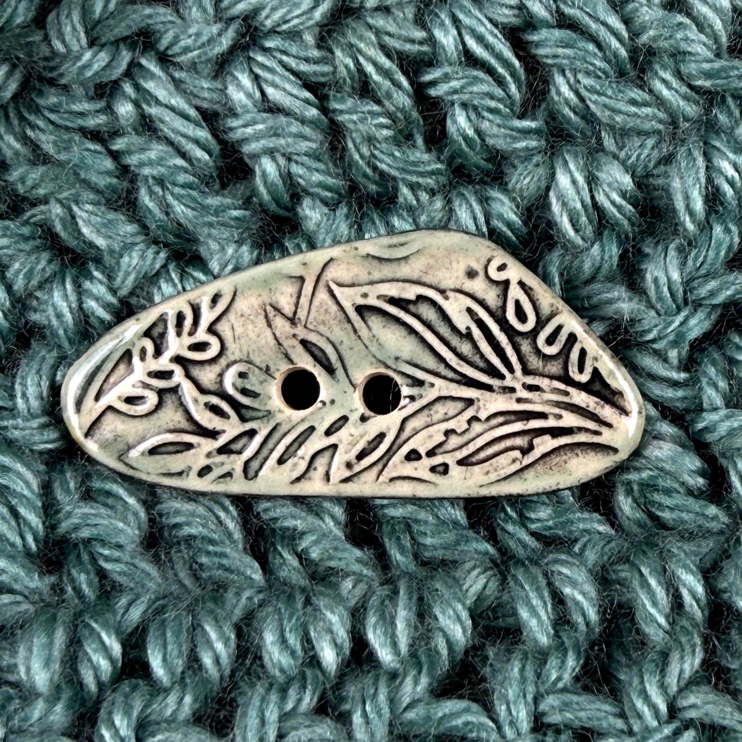 Green Washed Triangular Button with Flower and Plant Texture