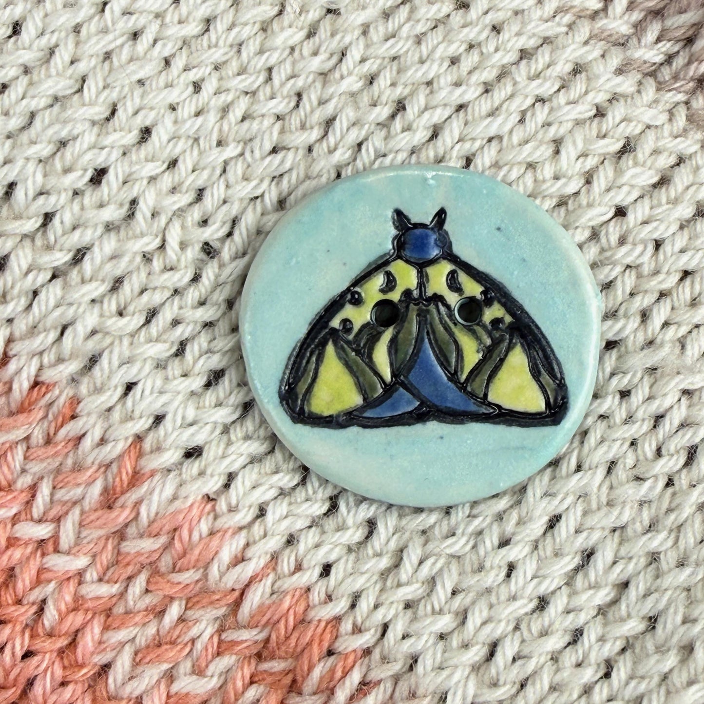 Dark Blue and Chartreuse Moth on Aqua Blue Ceramic Button
