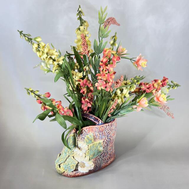 Pink and Purple Flower Brick/Vase with White  Flowers and Green Leaves