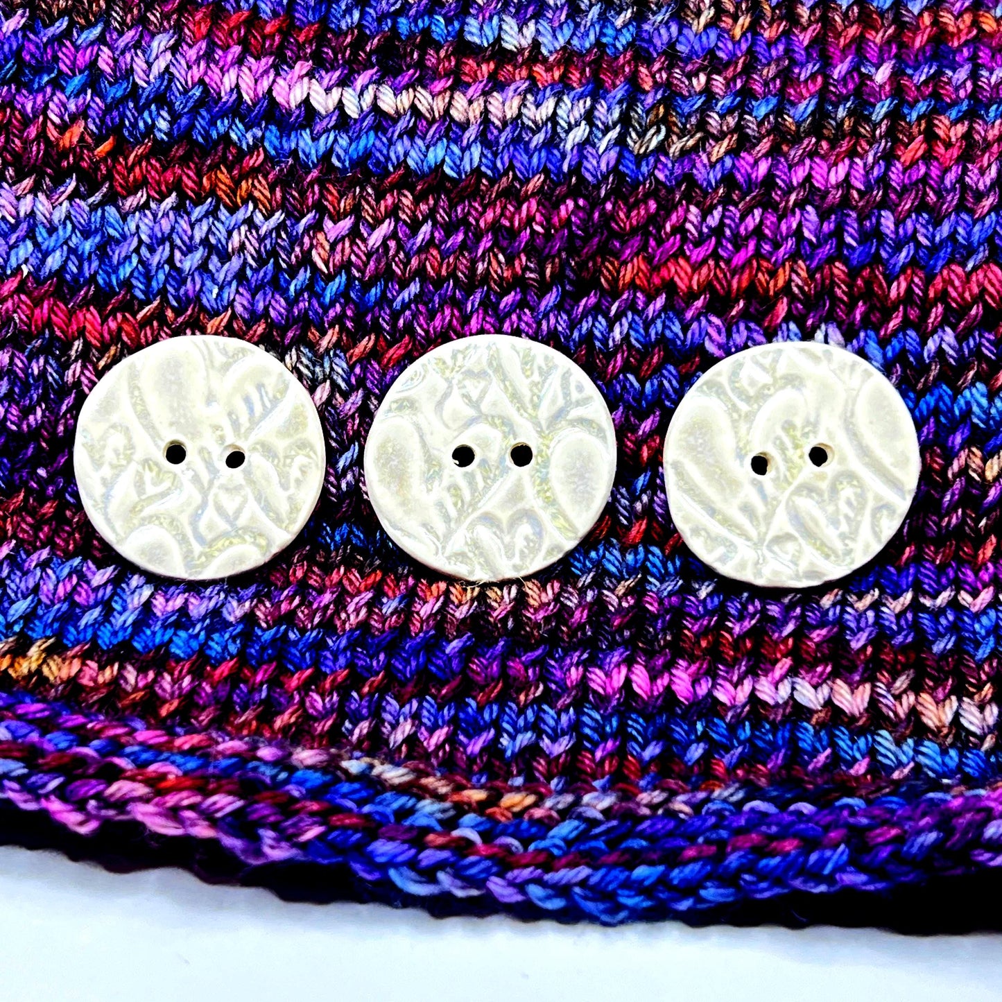 4 White Round Buttons with Light Gray Heart Pattern