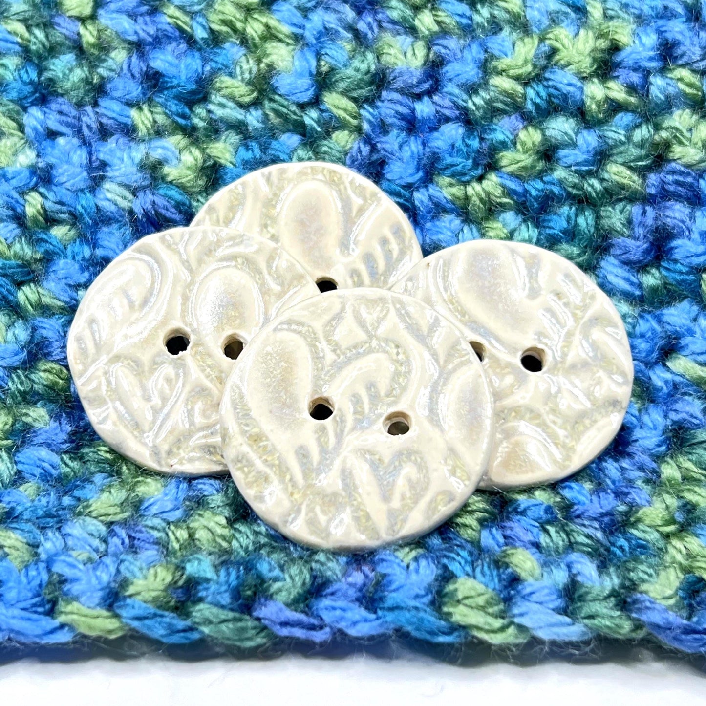 4 White Round Buttons with Light Gray Heart Pattern