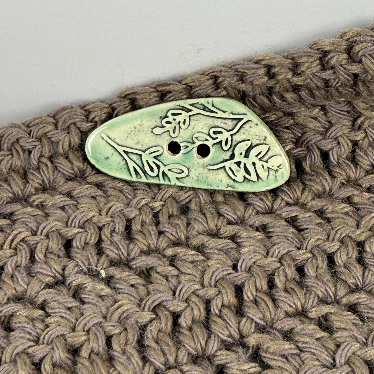 Green Washed Triangular Button with Flower and Plant Texture