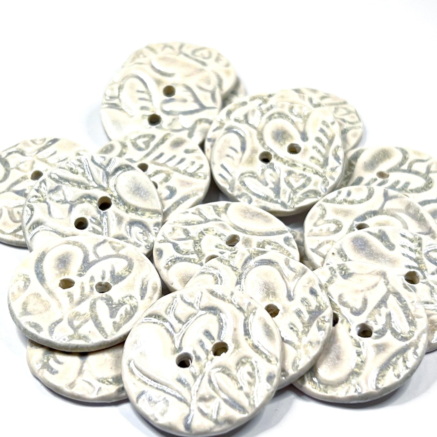 4 White Round Buttons with Light Gray Heart Pattern
