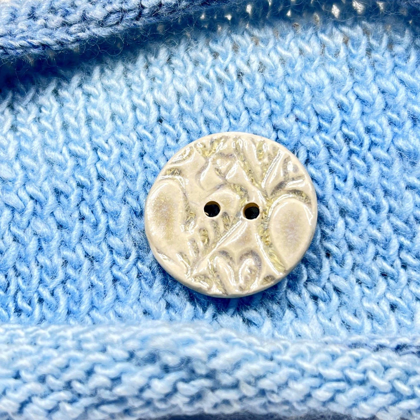 4 White Round Buttons with Light Gray Heart Pattern