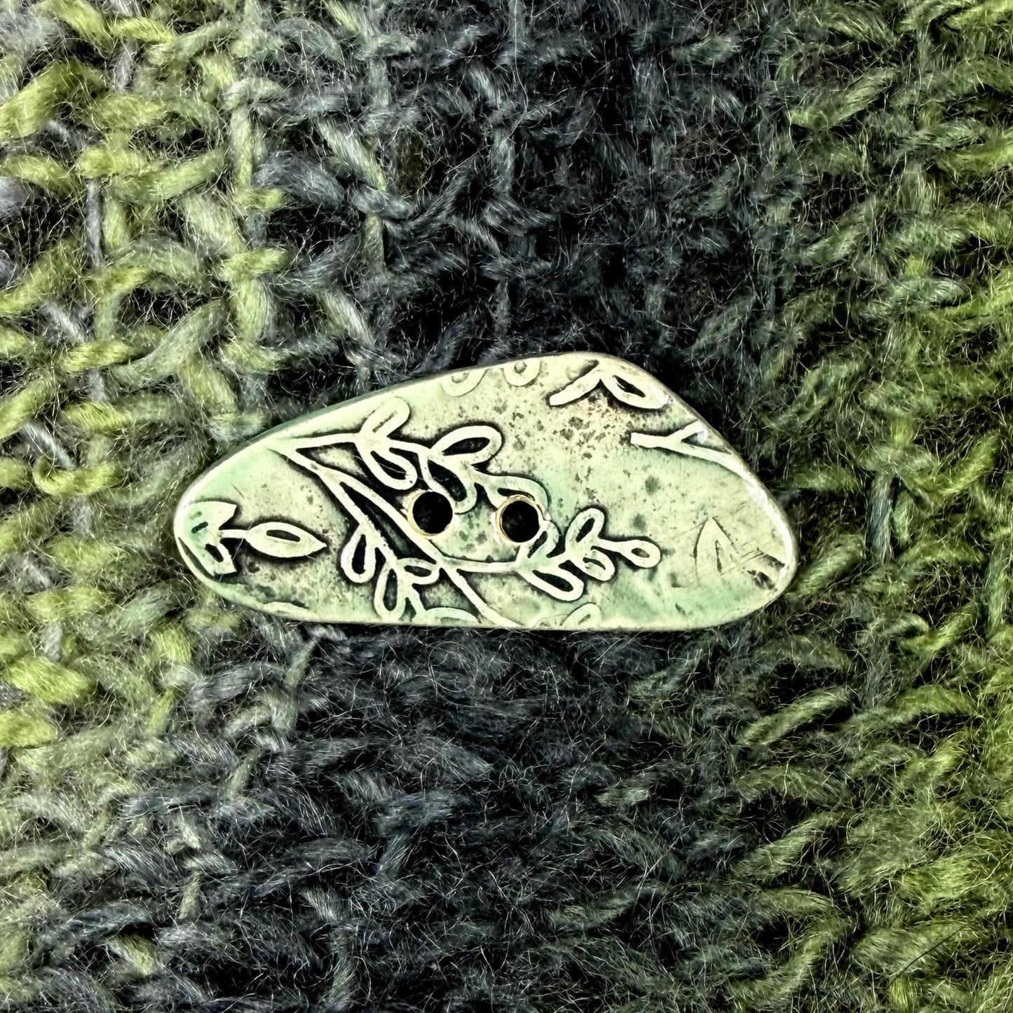 Green Washed Triangular Button with Flower and Plant Texture