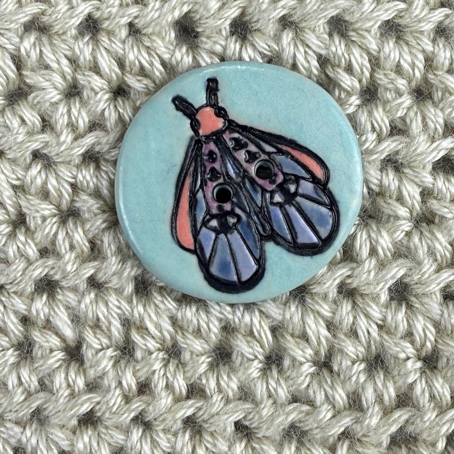 Blue Moth with Eyes on  Aqua Blue Ceramic Button