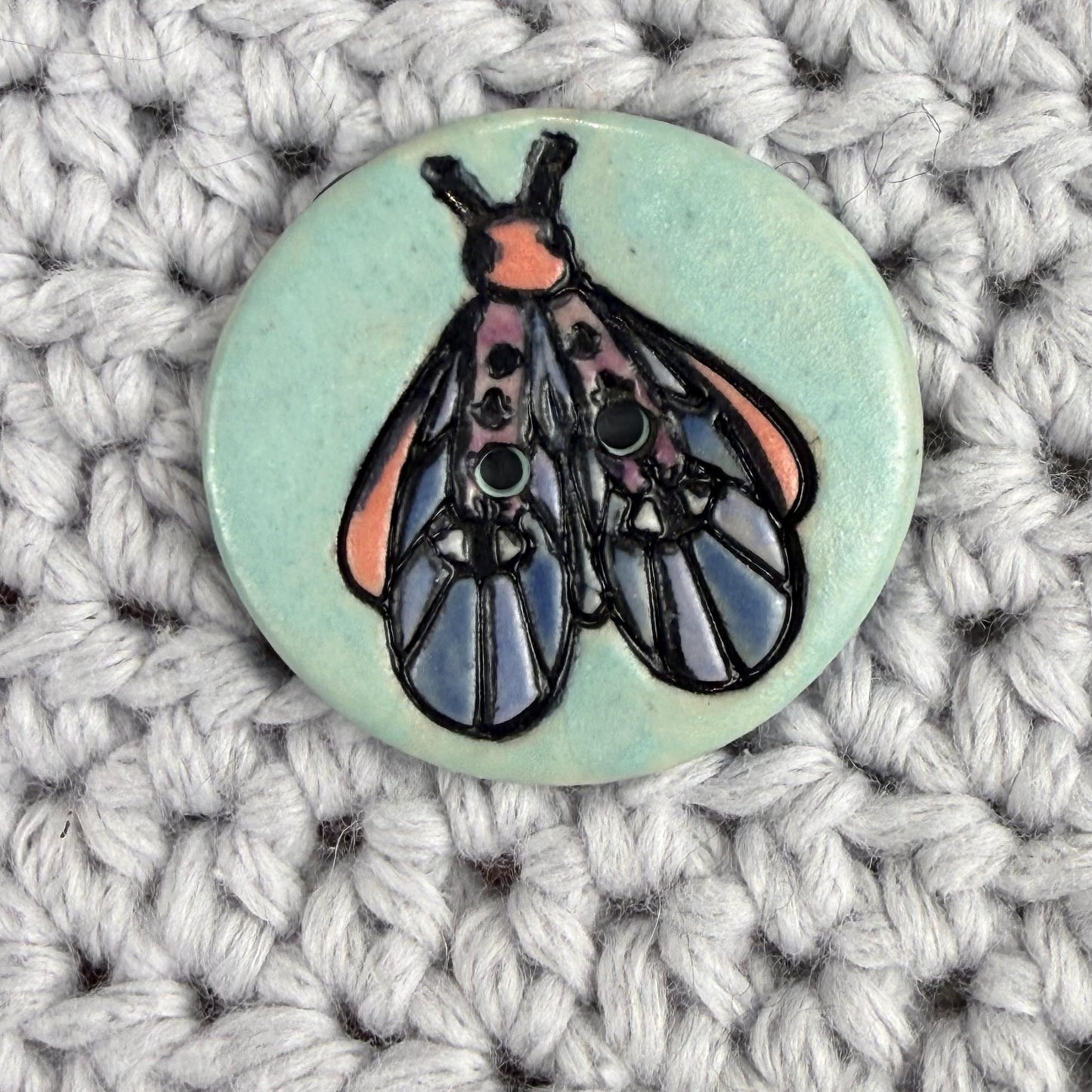 Blue Moth with Eyes on  Aqua Blue Ceramic Button