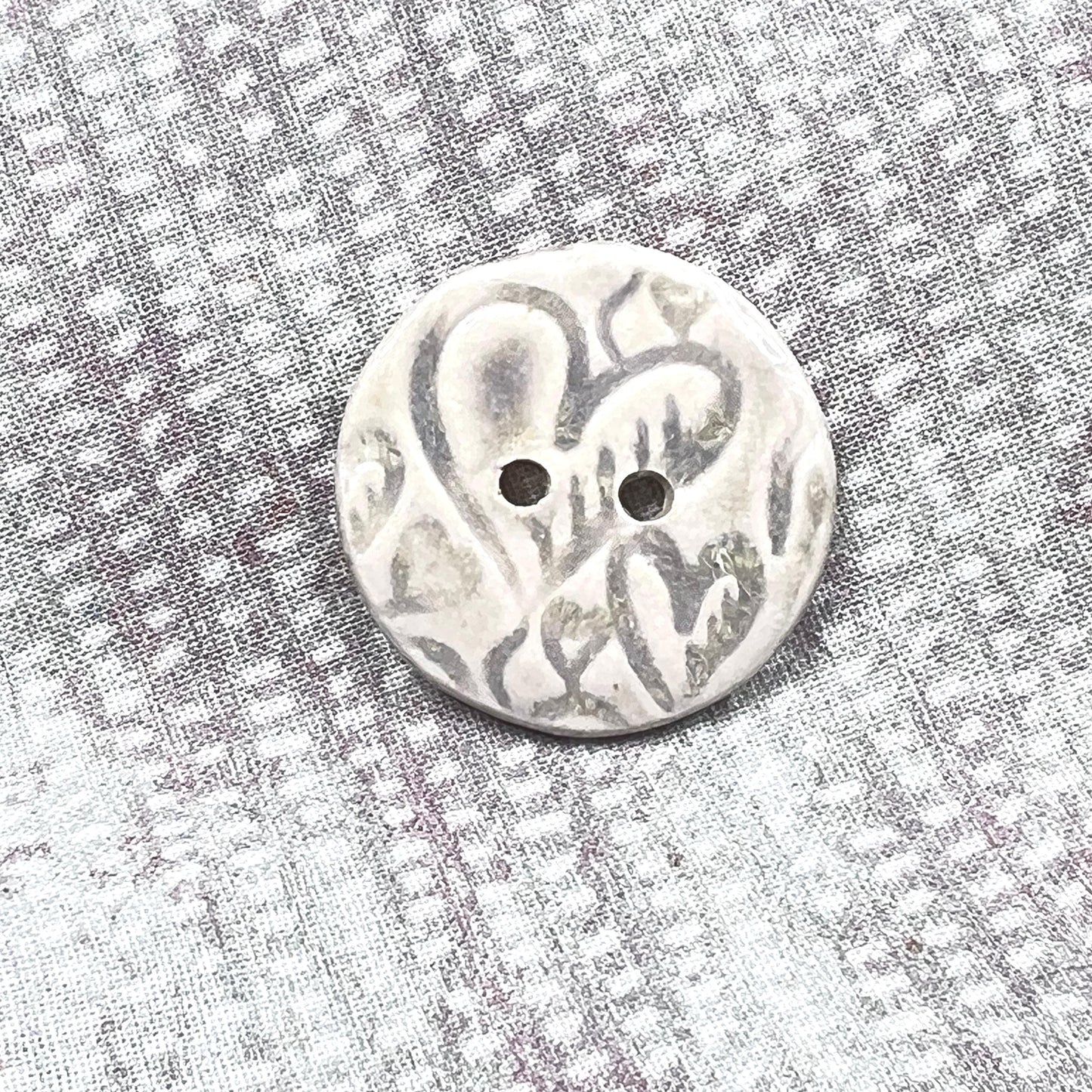 4 White Round Buttons with Light Gray Heart Pattern