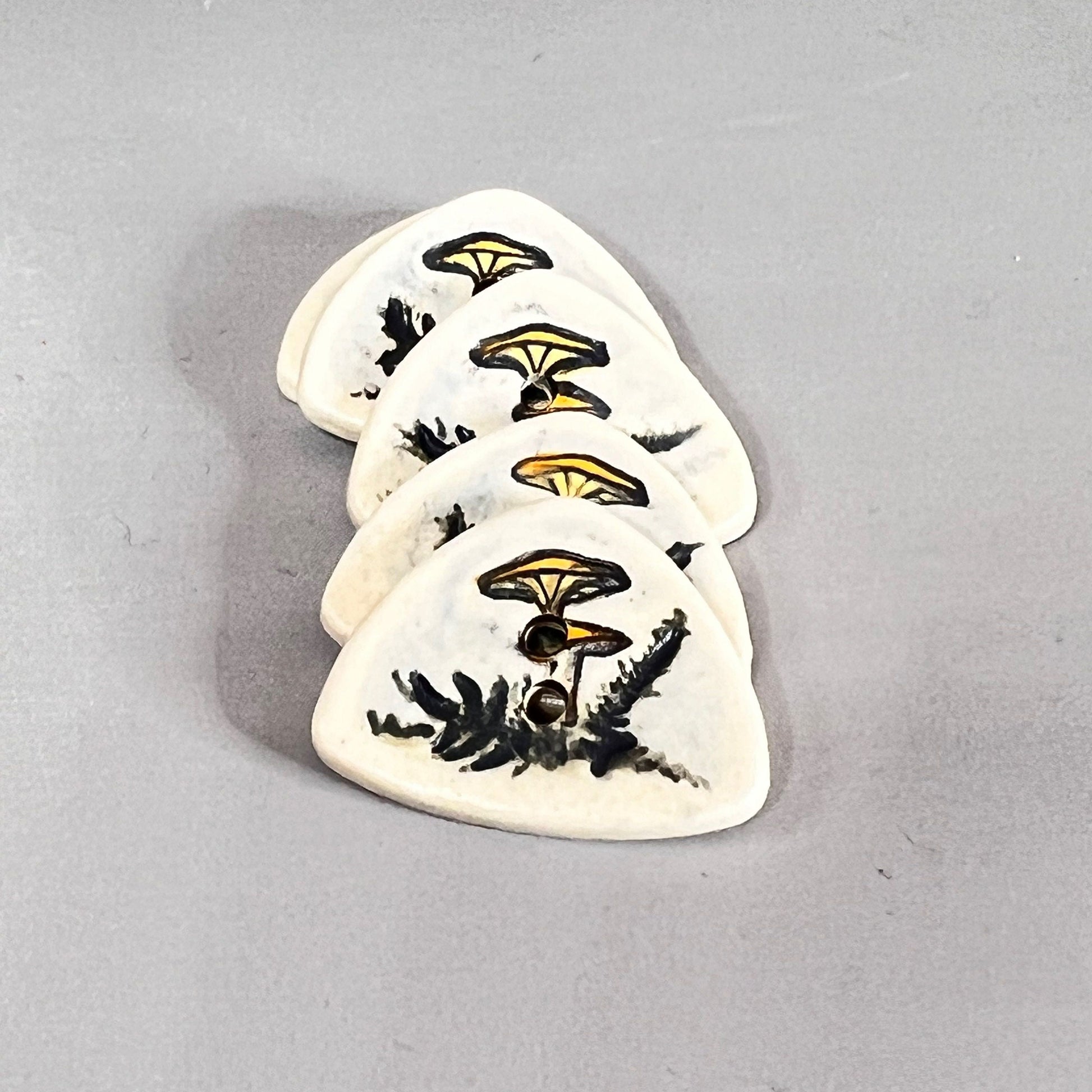 Yellow Cap Woodland Mushroom with Ferns on White Triangular Button