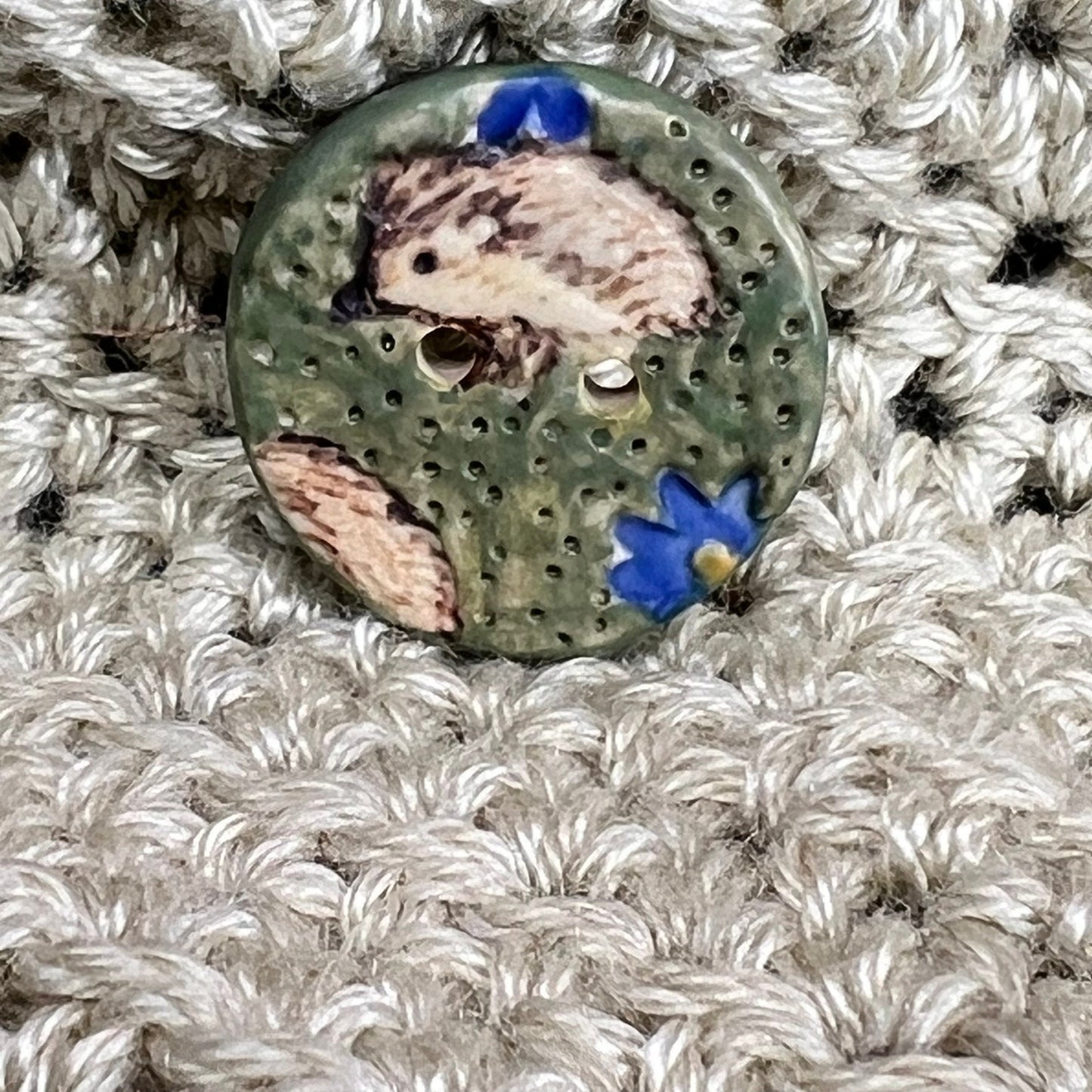 Hedgehog on Green Field with Blue Flowers Round Ceramic Button