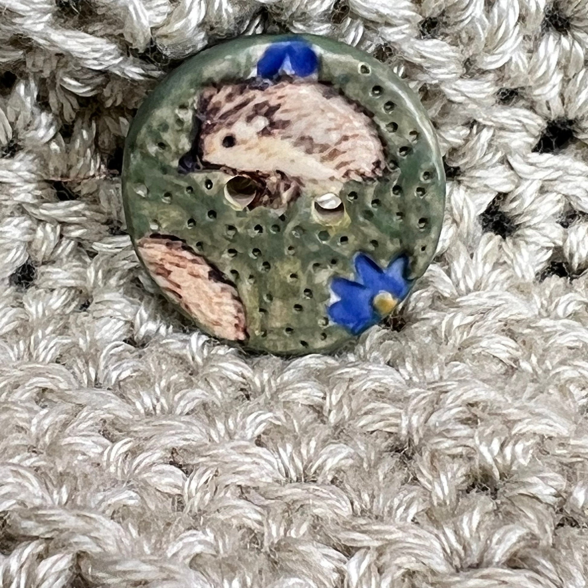 Hedgehog on Green Field with Blue Flowers Round Ceramic Button