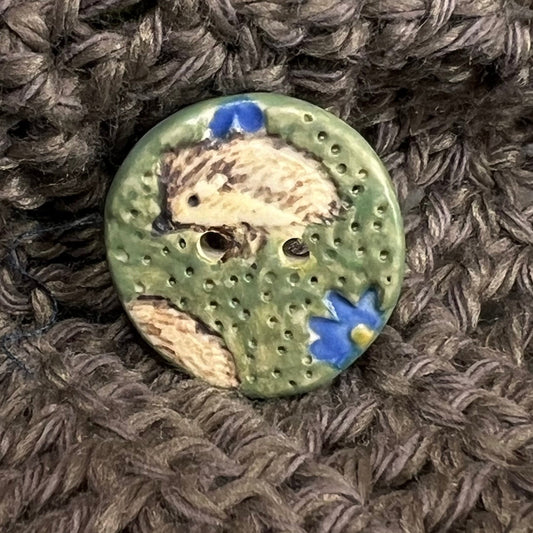 Hedgehog on Green Field with Blue Flowers Round Ceramic Button