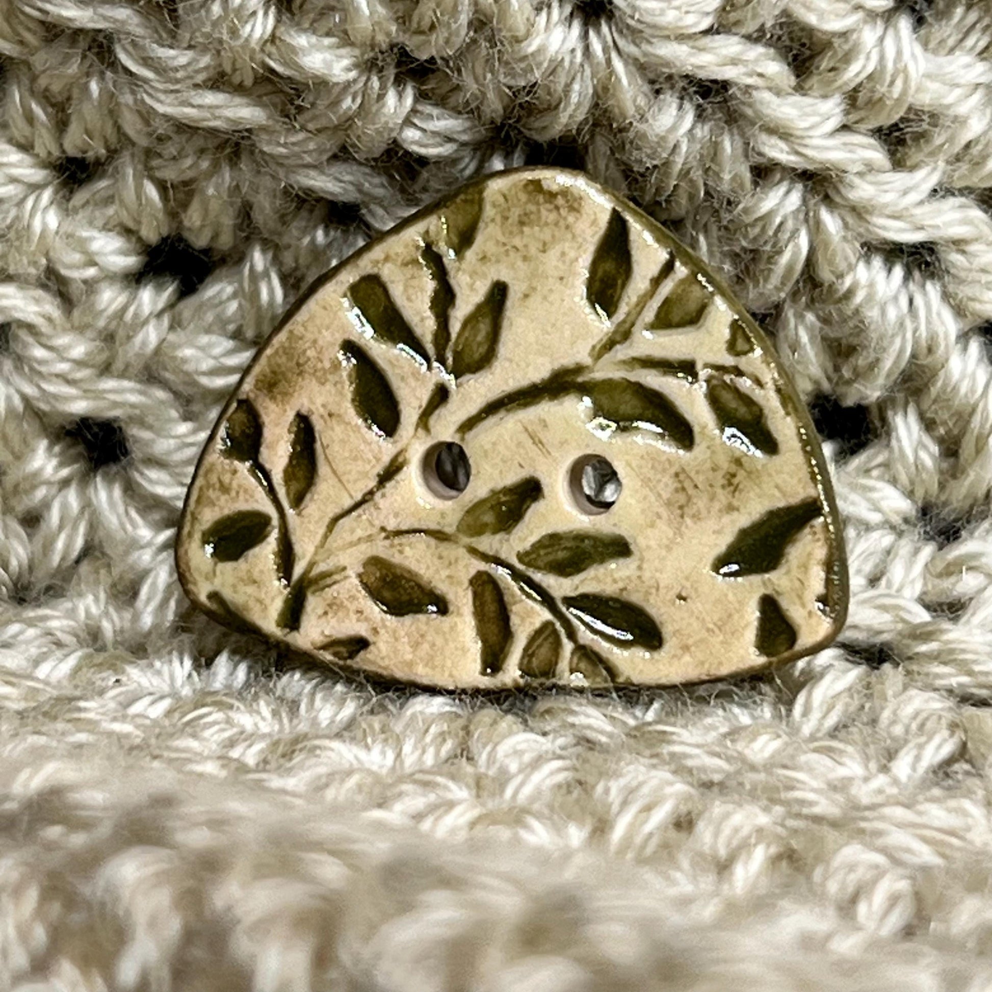 Avocado Green Leaves on Khaki Background Circular Triangle Shaped Ceramic Button