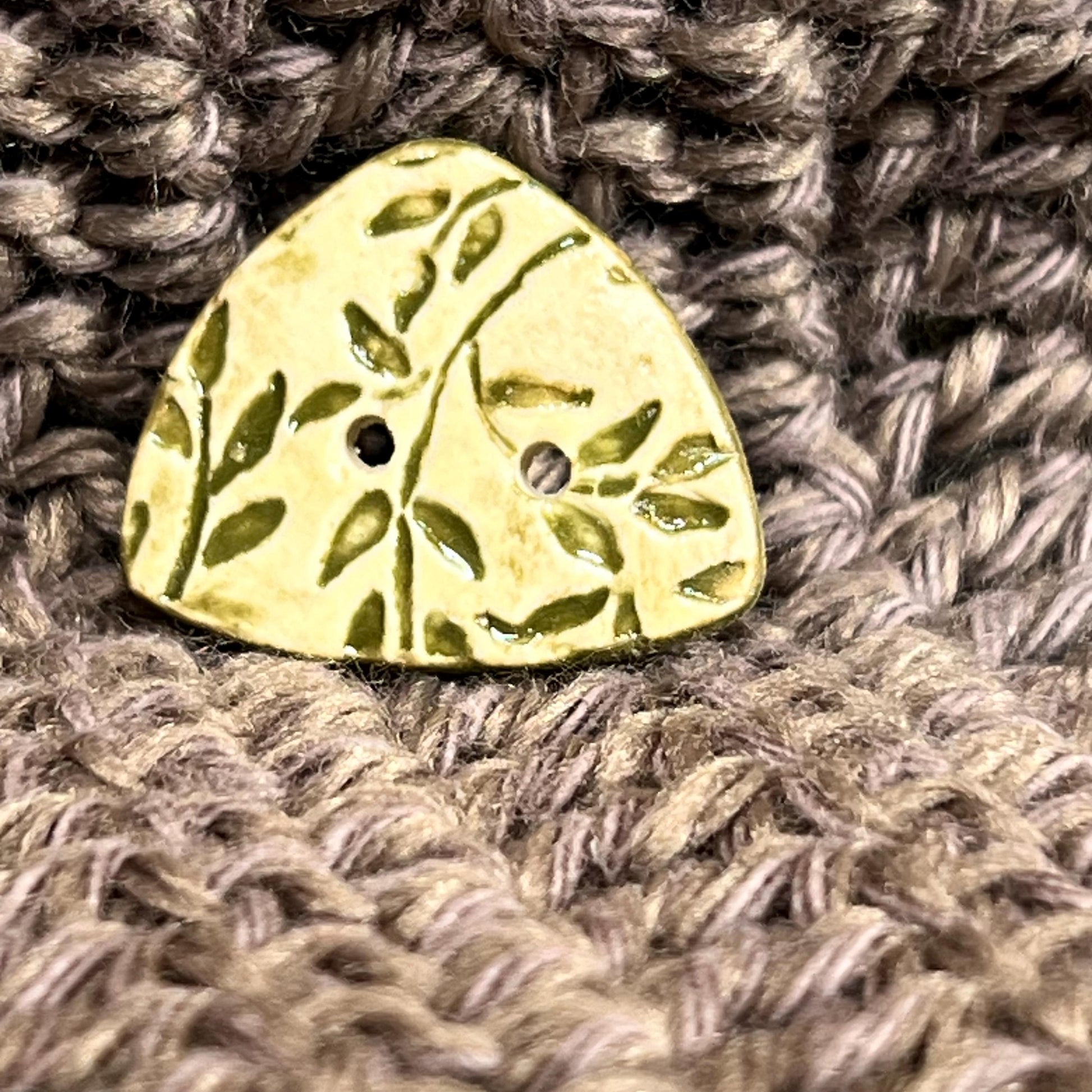 Avocado Green Leaves on Khaki Background Circular Triangle Shaped Ceramic Button