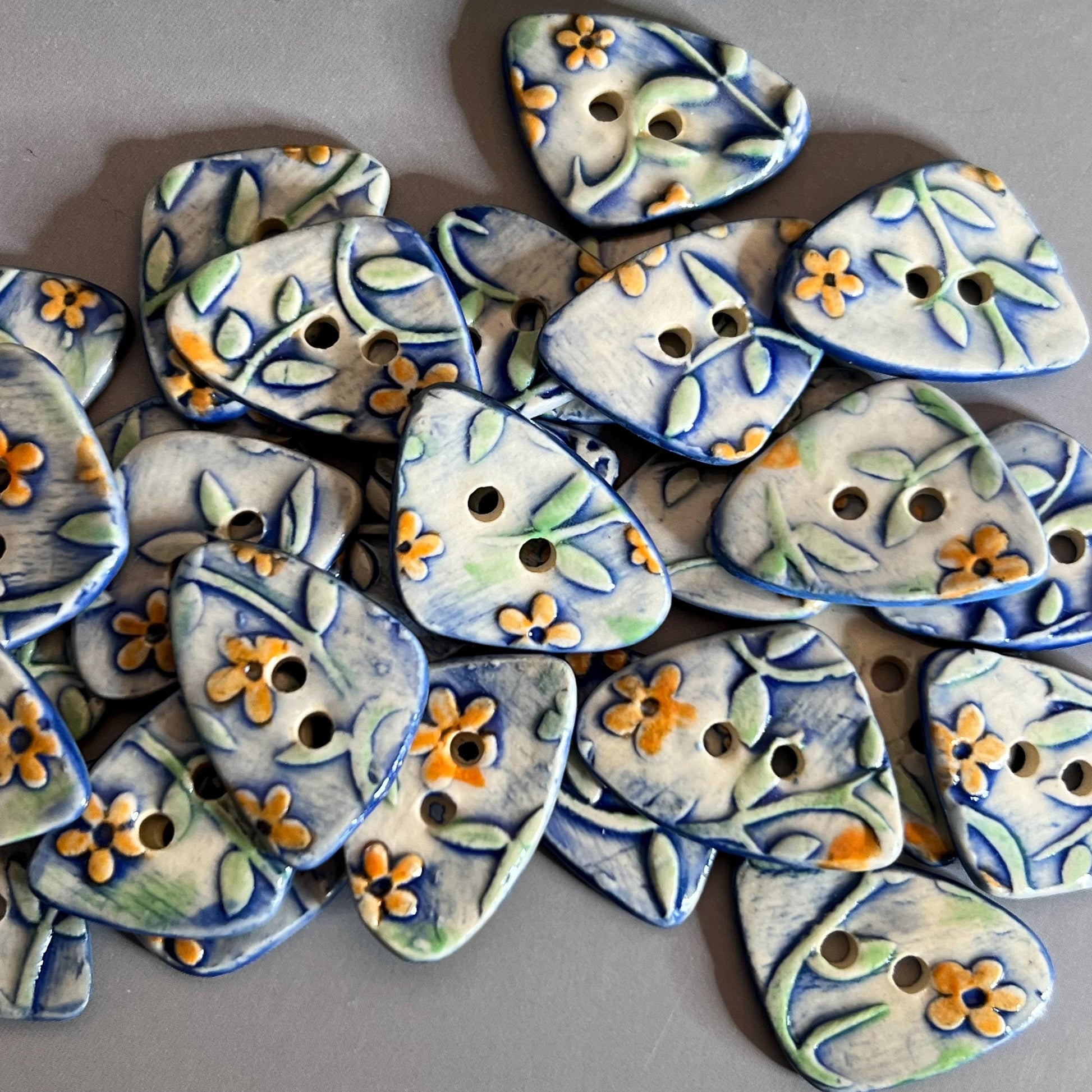 Orange Flowers on Blue and White Background Ceramic Large and Small Triangular Button