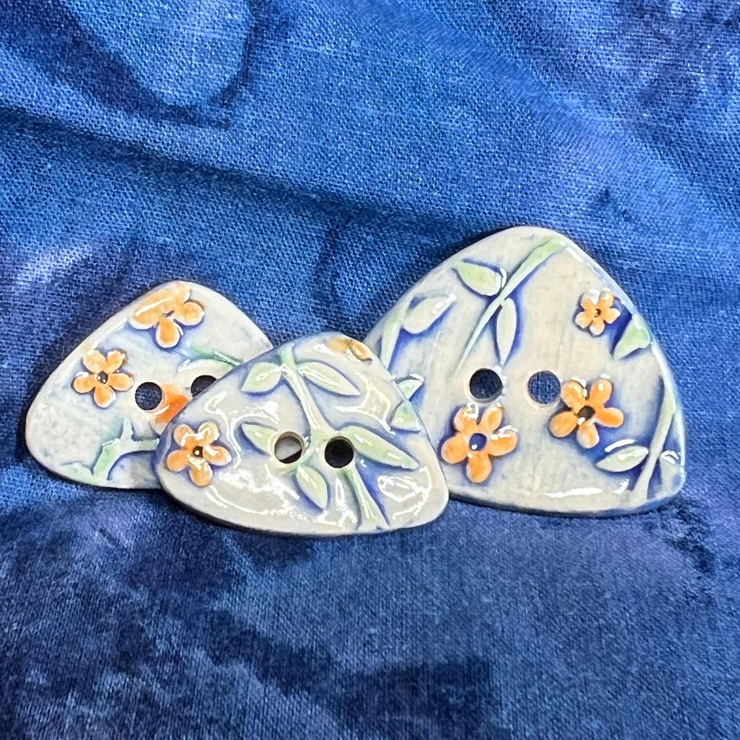 Orange Flowers on Blue and White Background Ceramic Large and Small Triangular Button