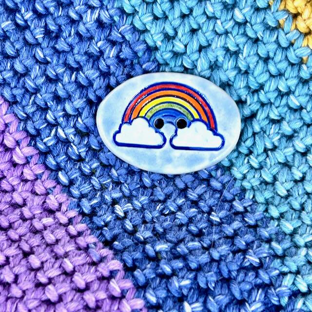 Large Rainbow on Light Blue Oval Button