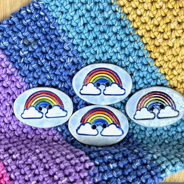 Large Rainbow on Light Blue Oval Button