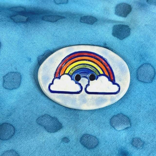 Large Rainbow on Light Blue Oval Button