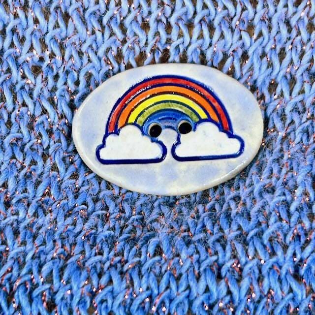 Large Rainbow on Light Blue Oval Button