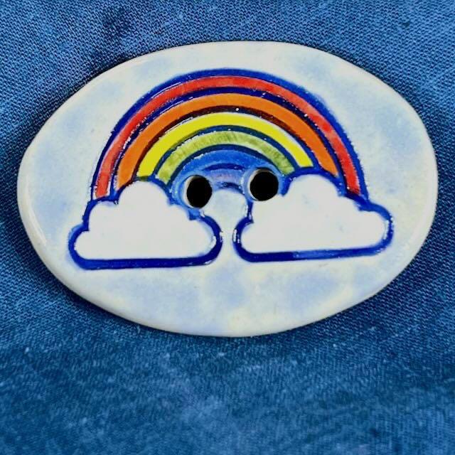 Large Rainbow on Light Blue Oval Button