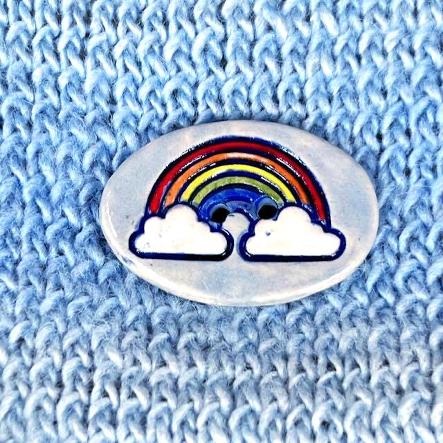 Large Rainbow on Light Blue Oval Button