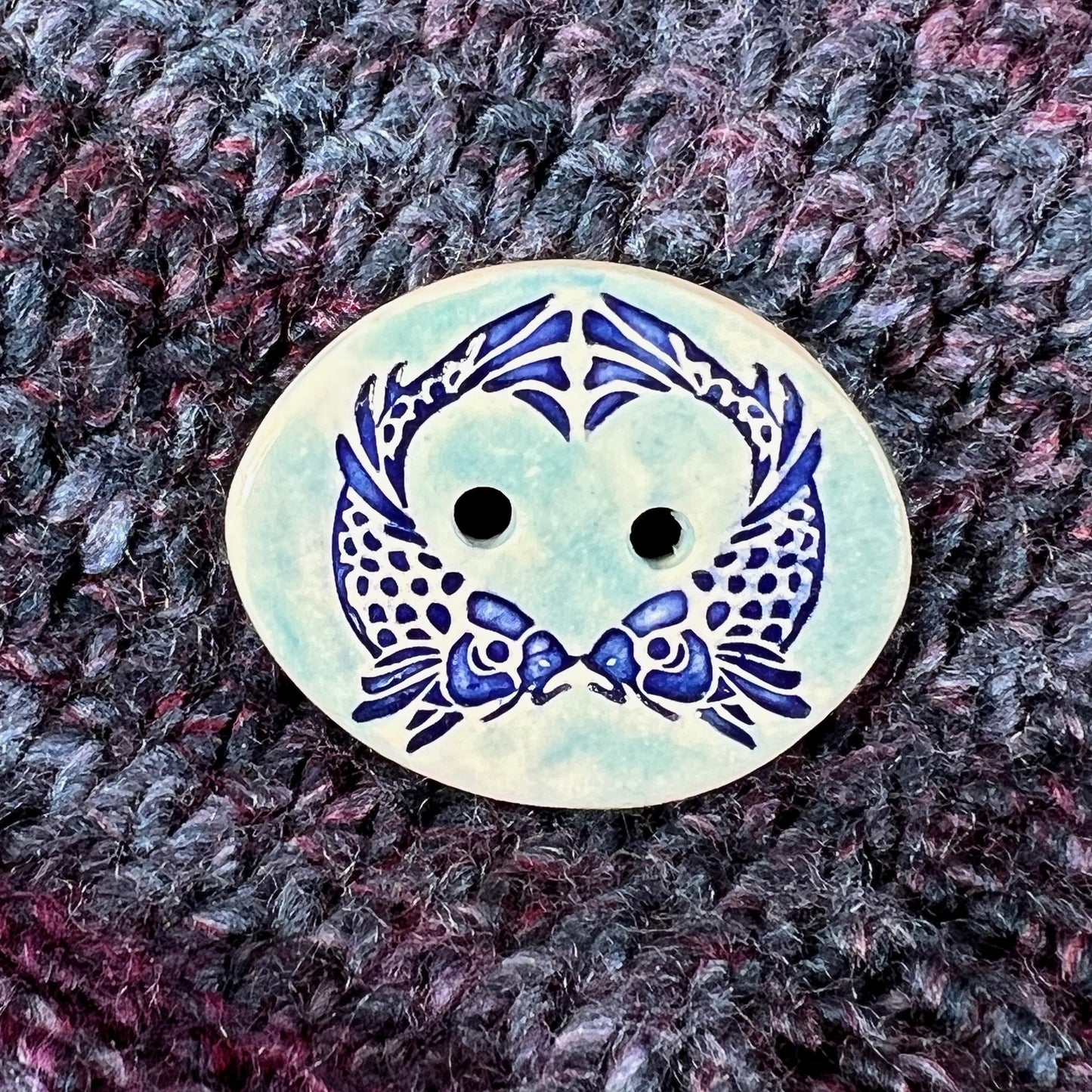Two Koi Heart on Light Blue Oval Button