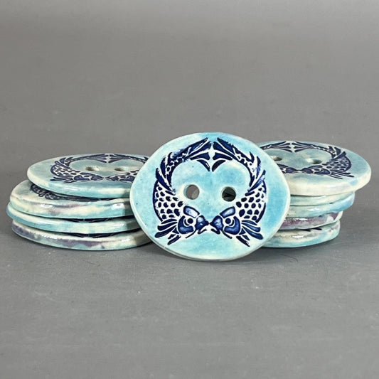 Two Koi Heart on Light Blue Oval Button