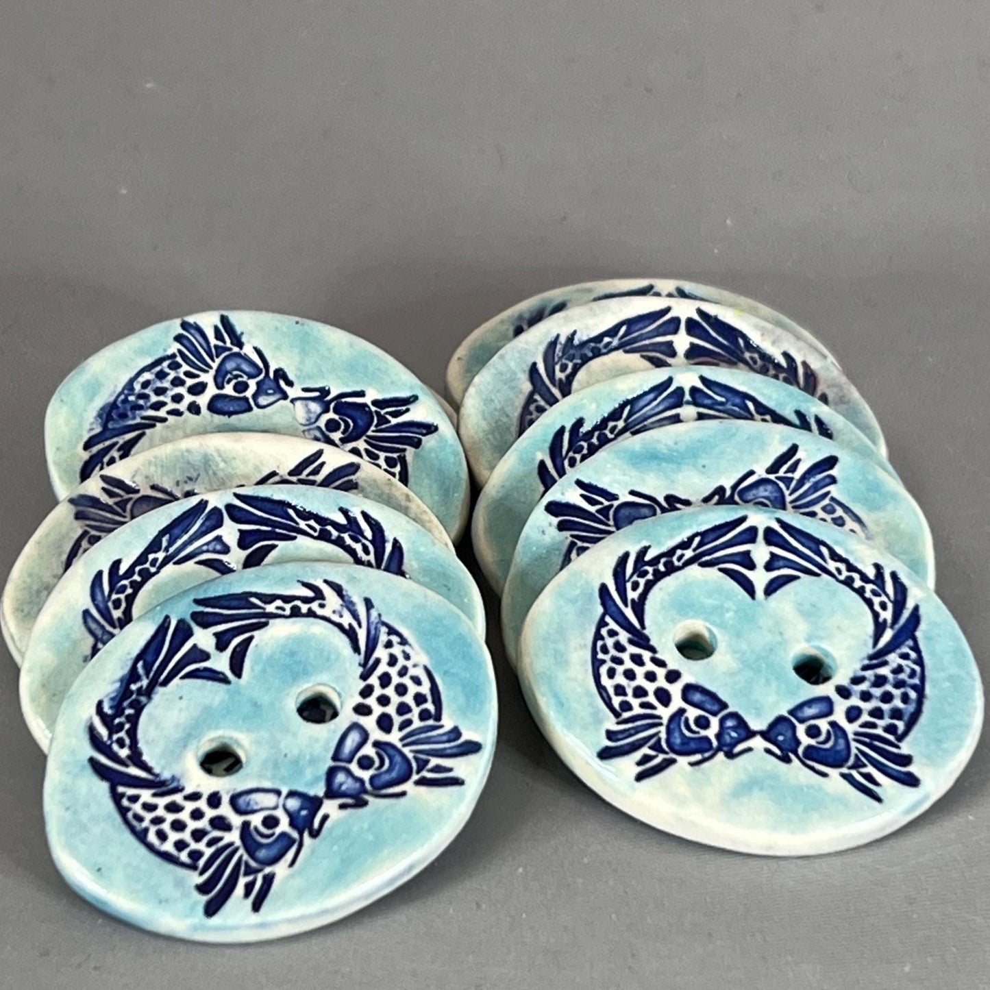 Two Koi Heart on Light Blue Oval Button