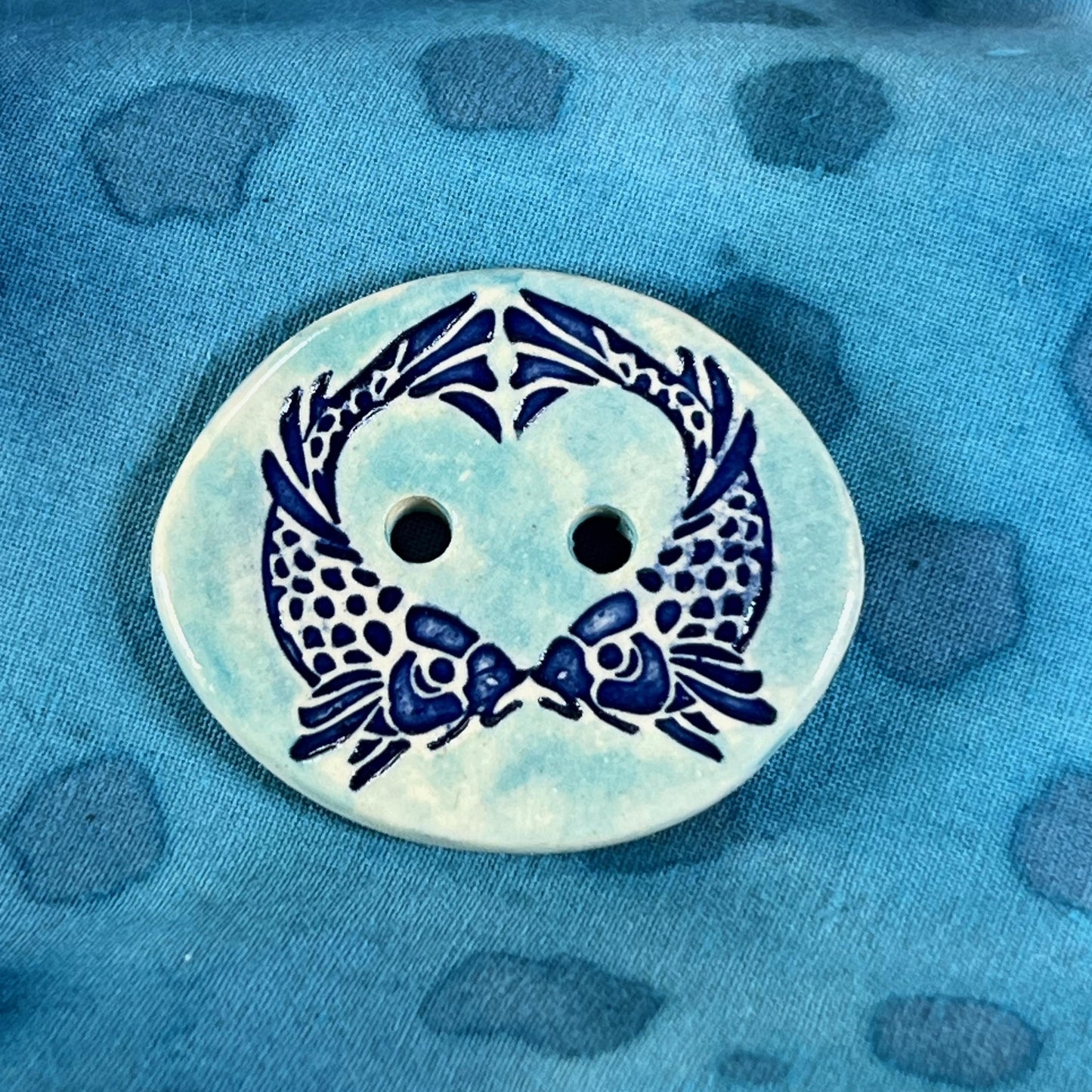 Two Koi Heart on Light Blue Oval Button
