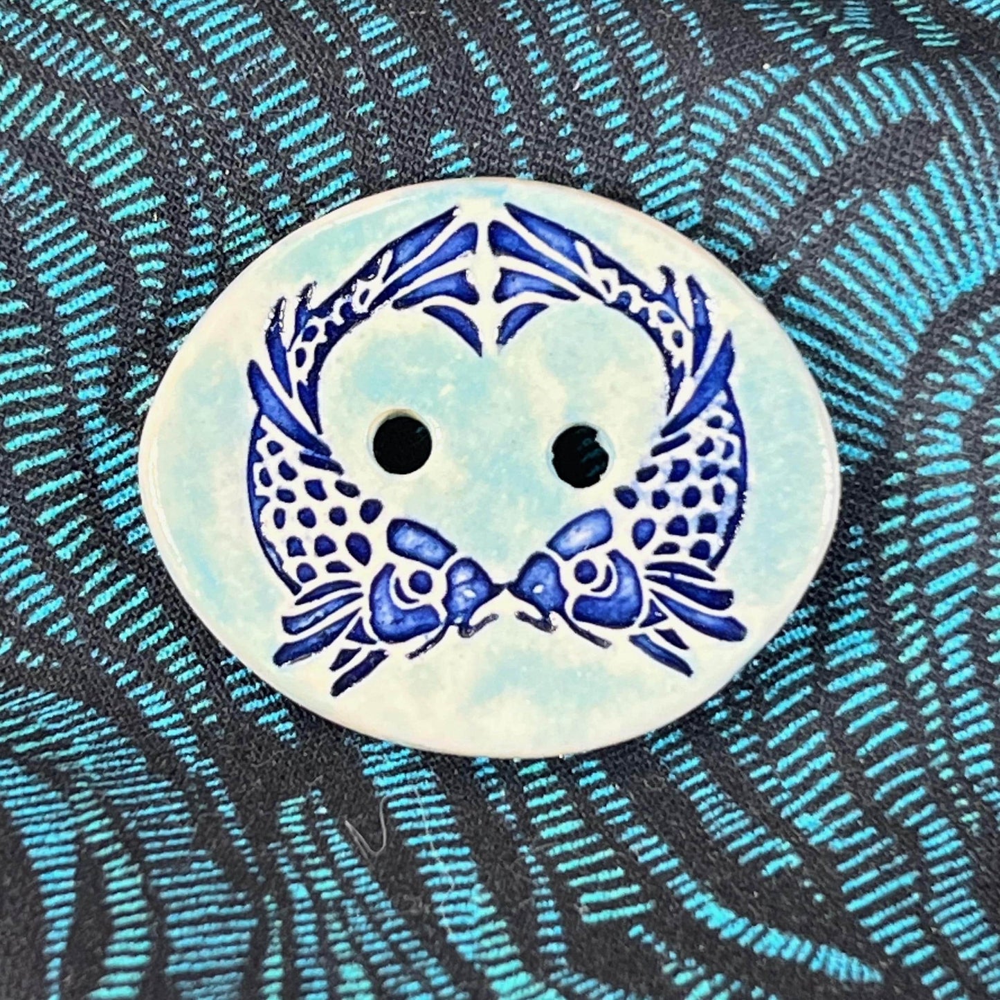 Two Koi Heart on Light Blue Oval Button