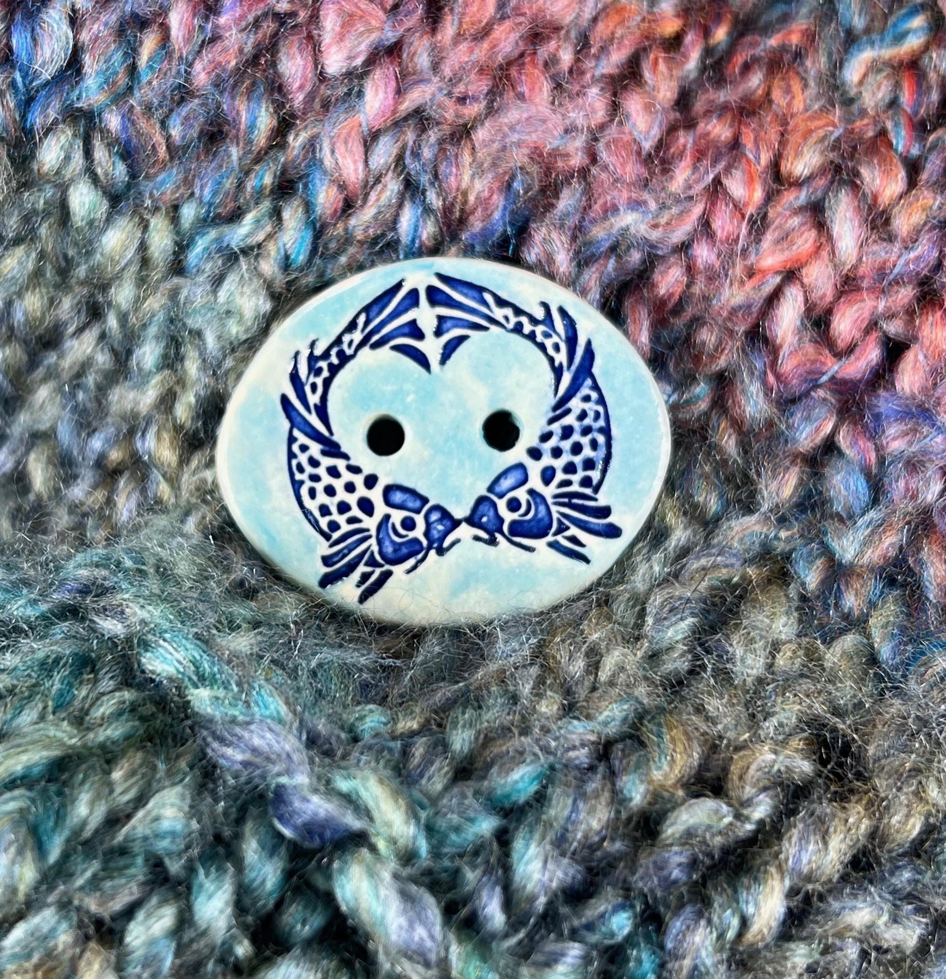 Two Koi Heart on Light Blue Oval Button